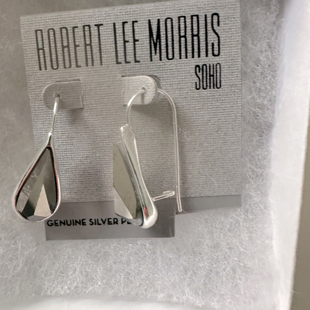 NWT silver earings. Received as gift but never used.